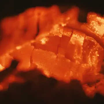 A glowing piece of charcoal, close up